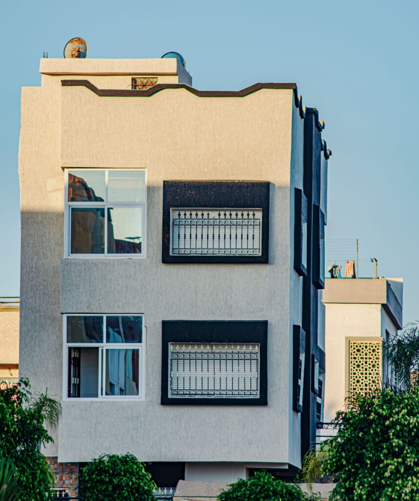 Contemporary urban building exterior with large windows and geometric design.